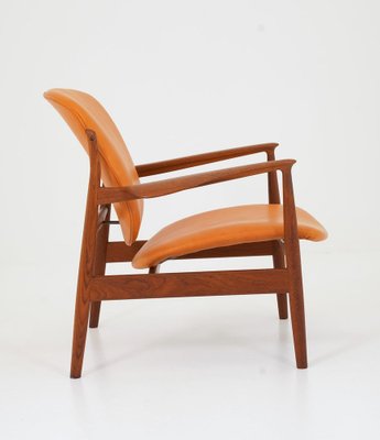 Model FD 136 Lounge Chair in Cognac Leather and Teak by Finn Juhl