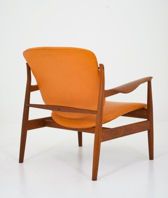 Model FD 136 Lounge Chair in Cognac Leather and Teak by Finn Juhl
