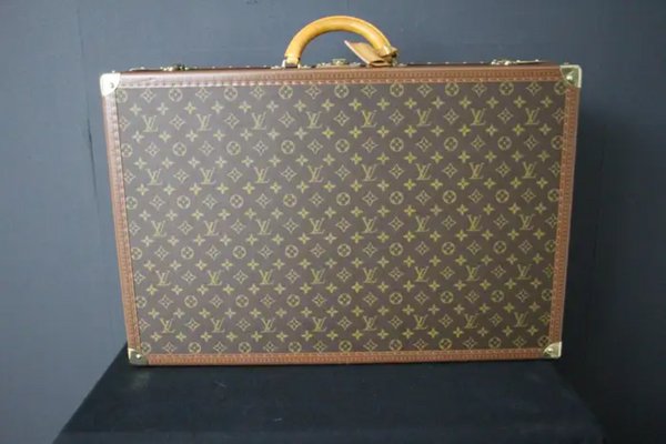 Vintage leather suitcase, by H. J. Cave and Sons of London, with