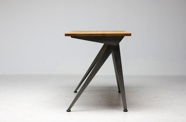 https://cdn20.pamono.com/p/g/1/7/1738169_3mwzqc5quf/compass-direction-desk-limited-raw-steel-and-natural-oak-by-jean-prouve-for-vitra-2023-4.jpg