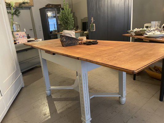 Antique dining table with leaves that pull sale out