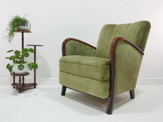 https://cdn20.pamono.com/p/g/1/7/1769083_y8qasgt3yl/mid-century-lounge-chair-germany-1960s-6.jpg