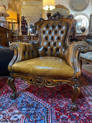 Aged leather armchair sales