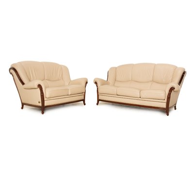 Beige leather reclining loveseat deals