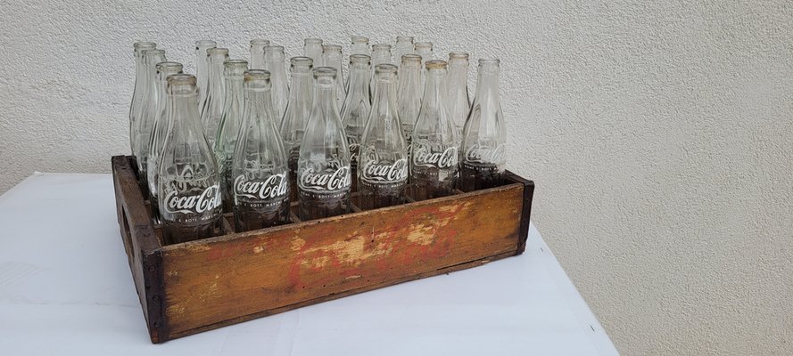 CN. 24 Bottiglie di Coca Cola, anni '60, set di 24 in vendita su Pamono