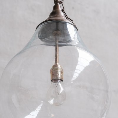 Large Clear Glass and Brass Bulb Shaped Pendant Light for sale at