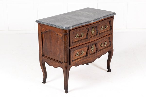 A French 18th Century Marble Top Walnut Commode A French 18th Century Marble Top Walnut Commode