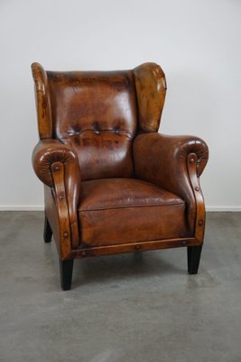Poltrona vintage in pelle marrone in vendita su Pamono
