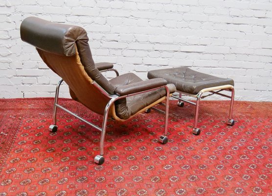 Leather armchair with footrest sale