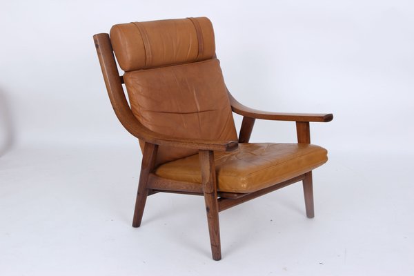 Model GE530A Armchair in Smoked Oak and Leather by Hans J Model GE530A Armchair in Smoked Oak and Leather by Hans J