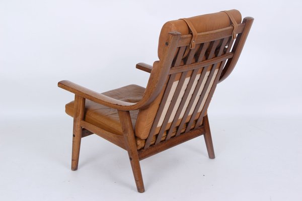 Model GE530A Armchair in Smoked Oak and Leather by Hans J Model GE530A Armchair in Smoked Oak and Leather by Hans J