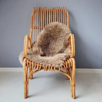 Rattan chair with sheepskin discount