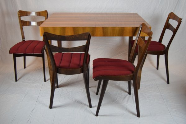 Mesa de comedor de teca con cuatro sillas, años 60 Mesa de comedor de teca con cuatro sillas, años 60