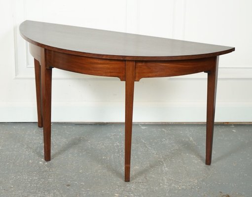 A George III Two Part Tilting Demi Lune Section Mahogany Dining Table A George III Two Part Tilting Demi Lune Section Mahogany Dining Table