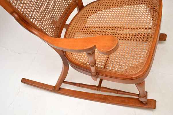 Antique cane rocking chair value new arrivals