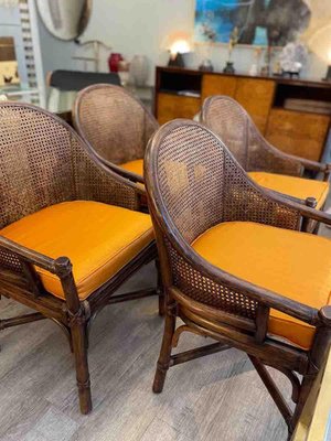Armlehnsthle aus Rattan & Bambus mit orangefarbenen Kissen von McGuire,  1970, 4er Set bei Pamono kaufen