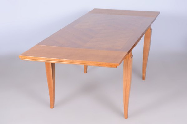 A Jules Leleu Bleached Oak Dining Table with Two Extension Leaves A Jules Leleu Bleached Oak Dining Table with Two Extension Leaves