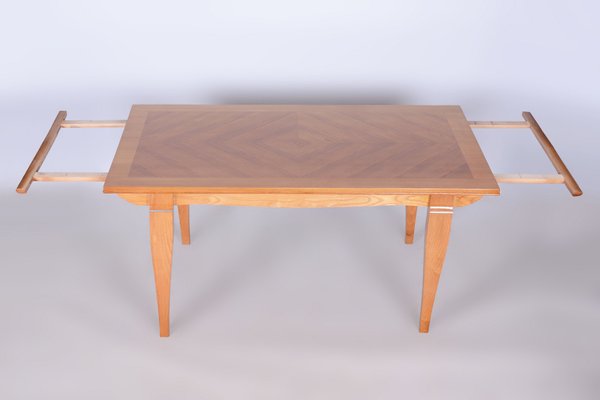 A Jules Leleu Bleached Oak Dining Table with Two Extension Leaves A Jules Leleu Bleached Oak Dining Table with Two Extension Leaves