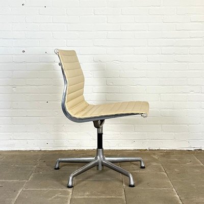 EA 106 Swivel Cream Leather Design Chair by Charles Ray Eames
