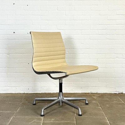EA 106 Swivel Cream Leather Design Chair by Charles Ray Eames