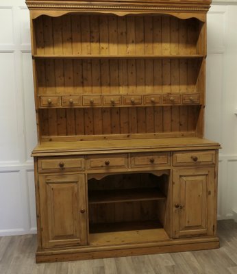 vintage pine dresser A monumental antique English with contrasting knobs others have tapered legs and urn 20th Century English Pine Dresser