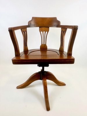 Antique swivel chair discount