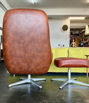 Vintage Vinyl Leather Lounge Swivel Chair and Ottoman in Cognac Brown 1970s Set of 2 for sale at Pamono