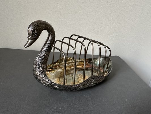 Porte-revues ou présentoir en forme de cygne en bronze patiné, C.C. 1960. - En vente sur France