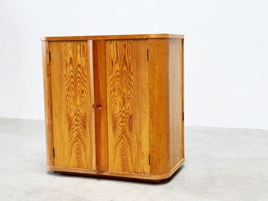 A Striking Mid-Century Two Door Cabinet by Jacques Adnet A Striking Mid-Century Two Door Cabinet by Jacques Adnet