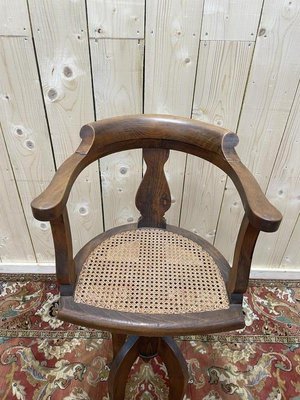 Poltrona da barbiere Paul Tournay in canna in vendita su Pamono - Main Image