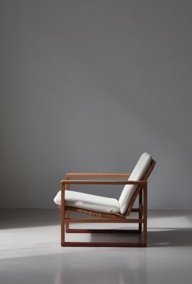 Set of Model 246 Lounge Chair and Ottoman in Oak and Teak Set of Model 246 Lounge Chair and Ottoman in Oak and Teak