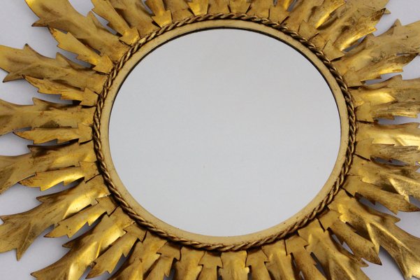 Espejo dorado en forma de sol