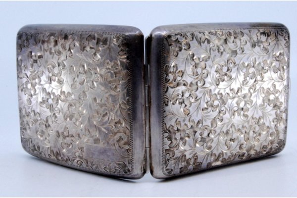Curved Silver Cigarette Case with Engraved Flowers and Cigarette Holders