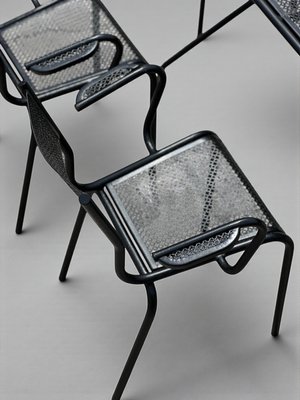 Perforated Metal Armchairs and Table in the style of Mathieu