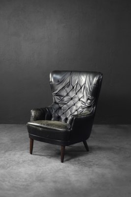 Schwarzer Dänischer Mid-Century Ohrensessel aus gestepptem Leder, 1960er bei Pamono kaufen