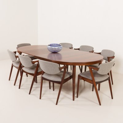 Tavolo Mid-Century rotondo allungabile in palissandro attribuito a