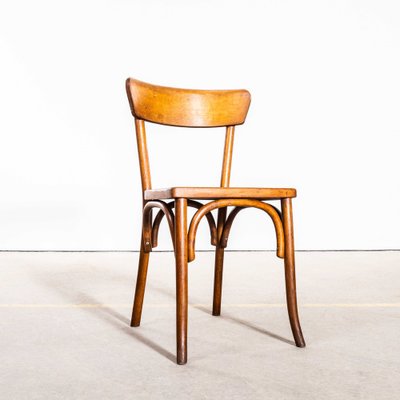 Honigfarbener Esszimmerstuhl mit schmaler Rückenlehne von Baumann, 1950er bei Pamono kaufen