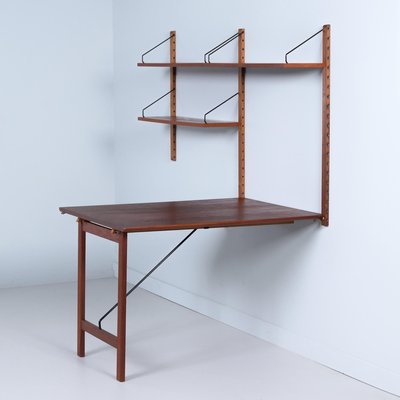 Royal System Wall Unit in Teak with Fold-Out Desk by Poul Cadovius Royal System Wall Unit in Teak with Fold-Out Desk by Poul Cadovius
