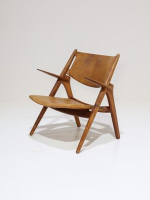CH28 Lounge Chair in Oak and Cognac Leather by Hans J. Wegner
