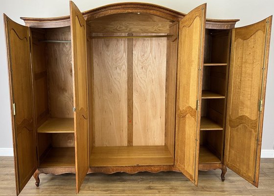 Vintage French Louis XVI Style Carved Oak 4-Door Armoire Vintage French Louis XVI Style Carved Oak 4-Door Armoire