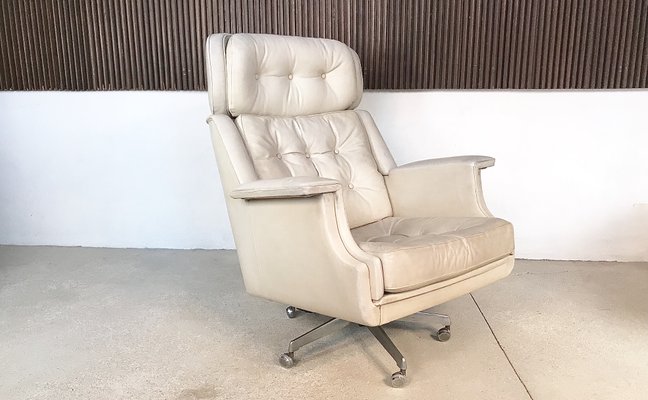 Tufted leather swivel armchair new arrivals