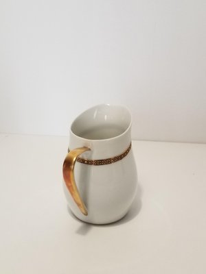 https://cdn20.pamono.com/p/g/3/8/383345_a5duon18o4/limoges-porcelain-coffee-set-from-alexandre-chastagner-1960s-set-of-22-9.jpg