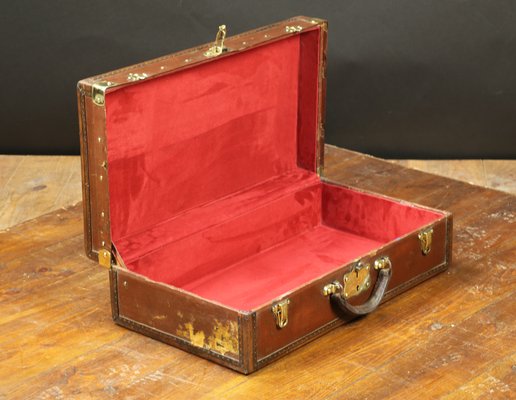 red leather suitcase
