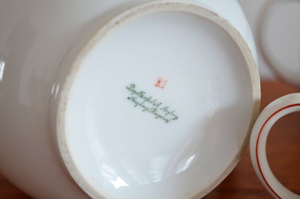 Tea cup with saucer Arzberg shape 1382 red edge design Dr Hermann Gretsch porcelain 221g height 5 cm