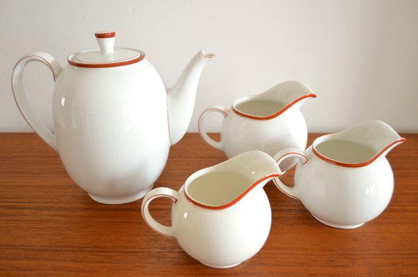 Tea cup with saucer Arzberg shape 1382 red edge design Dr Hermann Gretsch porcelain 221g height 5 cm