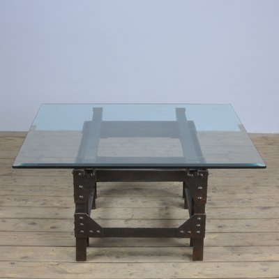 Cast iron table with glass top deals