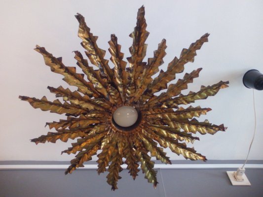 Sunburst sconce deals