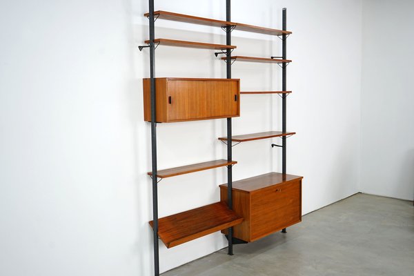 Scandinavian Shelving Unit With Reversible Sliding Doors From Pira