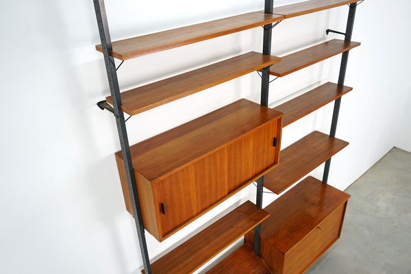 Scandinavian Shelving Unit With Reversible Sliding Doors From Pira