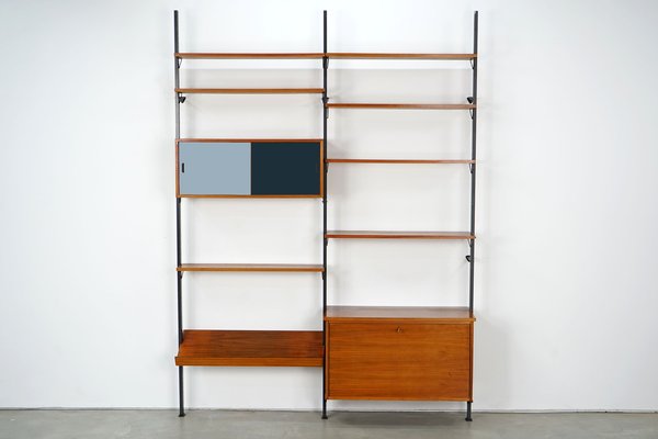 Scandinavian Shelving Unit With Reversible Sliding Doors From Pira